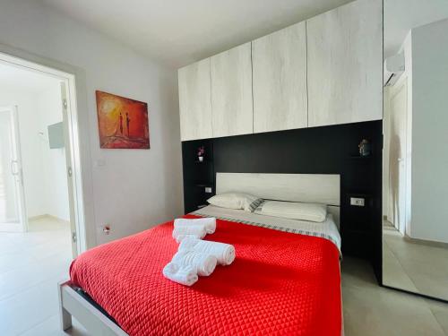 Ένα ή περισσότερα κρεβάτια σε δωμάτιο στο Holiday In Porto Cesareo