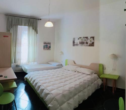 Säng eller sängar i ett rum på Affittacamere Sardegna Sole e Mare