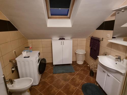 a small bathroom with a toilet and a sink at KFN Concept One in Zagreb