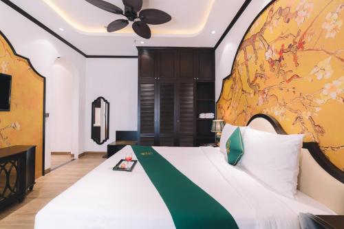 Кровать или кровати в номере Goldient Boutique Hotel