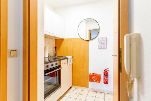 a small kitchen with a sink and a stove at Work & Stay Apartment 2 rooms in Pohlheim