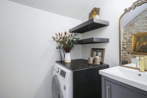 a laundry room with a washer and dryer at Brand New Manayunk Retreat 2BR including parking in Philadelphia