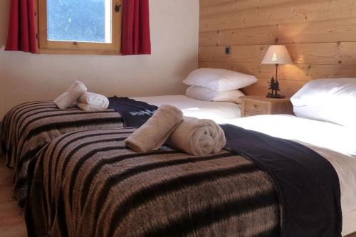 מיטה או מיטות בחדר ב-Montseti - 3 bedroom ski-in ski-out apartment