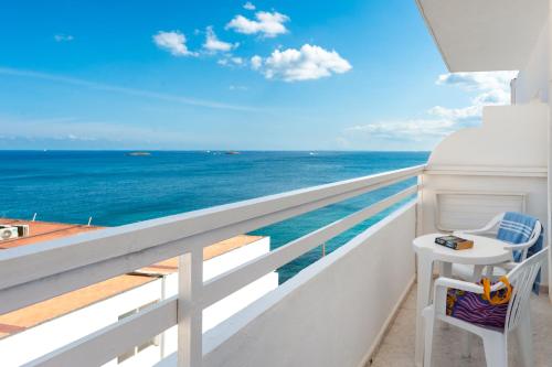 a balcony with a view of the ocean at Hotel Apartamentos Vibra Lux Mar in Ibiza Town