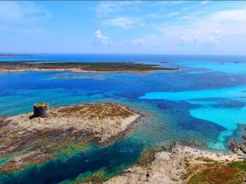 an aerial view of an island in the ocean at B&B SHARDANA in Sennori