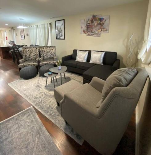 a living room with a couch and a table at Cozy Bay Home Beach+Casino+More in Atlantic City