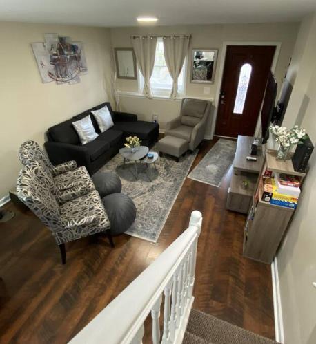 an aerial view of a living room with a couch and chairs at Cozy Bay Home Beach+Casino+More in Atlantic City