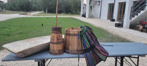 two wooden barrels sitting on top of a blue table at Agroturystyka Głuchowskie Specjały in Głuchów
