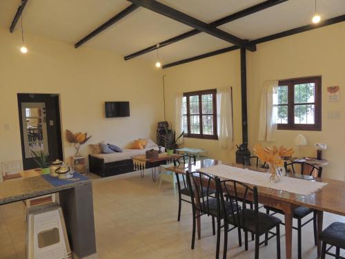 a living room with a table and a couch at La casita de Cerrillos in Salta