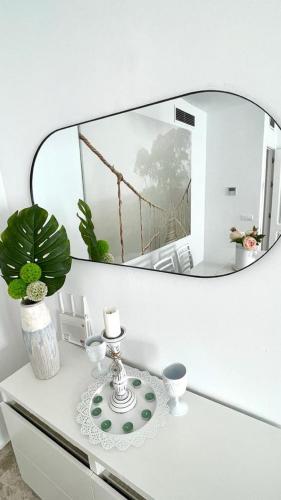 a mirror sitting on top of a white table at Los Naranjos close to Puerto Banus in Marbella