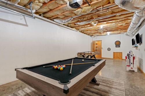 a pool table in a room with a ping pong ball at Deer Run Retreat in Ellijay