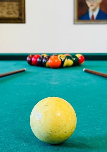 a pool ball on top of a pool table at Change The World - Solar de Alvega in Alvega