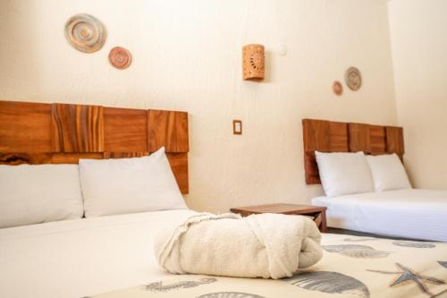 Katil atau katil-katil dalam bilik di Hotel Pelicano
