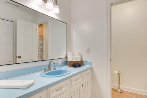 a bathroom with a sink and a large mirror at Charleston Vacation Rental about 7 Mi to Folly Beach! in Charleston