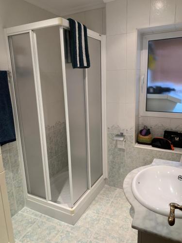 a bathroom with a shower and a sink at Nice Home+Wifi+AC+Netflix in Valladolid