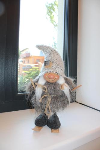 a bird toy sitting on a window sill at SKI Apartmán Snowcat in Abertamy