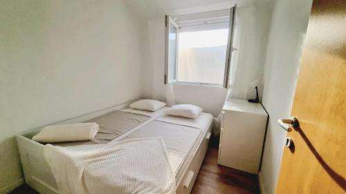 Ένα ή περισσότερα κρεβάτια σε δωμάτιο στο Apartman Neva