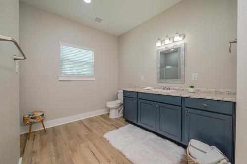 a bathroom with a blue sink and a mirror at The Oasis Resort in Rockport