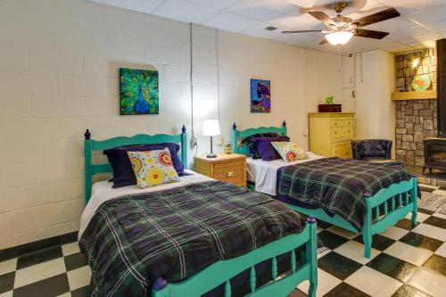 A bed or beds in a room at Killen Vacation Rental Walk to Wilson Lake!