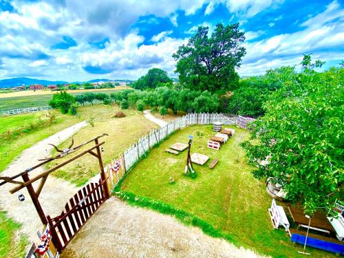 an aerial view of a park with benches and a fence at O.K. Corral in SantʼAndrea in Casale