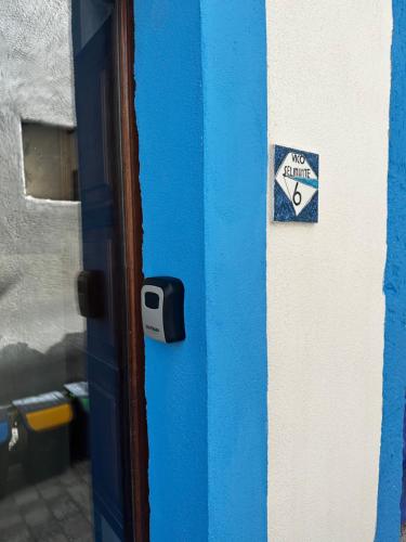a blue door with a no entry sign on it at Poseidone 2 in Lipari