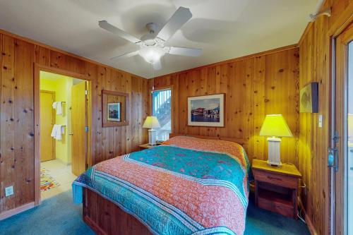 a bedroom with a bed and a ceiling fan at Fiddlesticks #4-2 in Avon