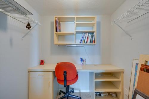 a desk with a red chair in a room at Marco Island Condo with Ocean Views and Resort Perks! in Marco Island