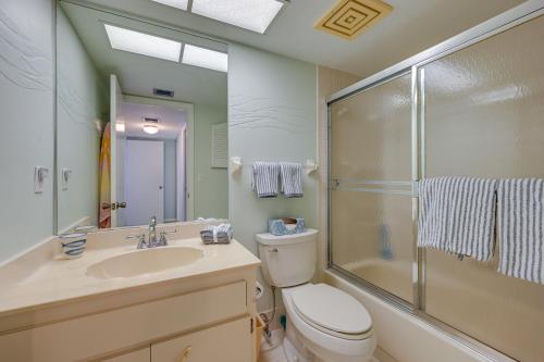 a bathroom with a toilet and a sink and a shower at Marco Island Condo with Ocean Views and Resort Perks! in Marco Island