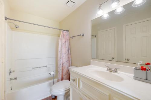 a bathroom with a sink and a toilet and a mirror at Houston Vacation Rental 14 Mi to Downtown in Houston