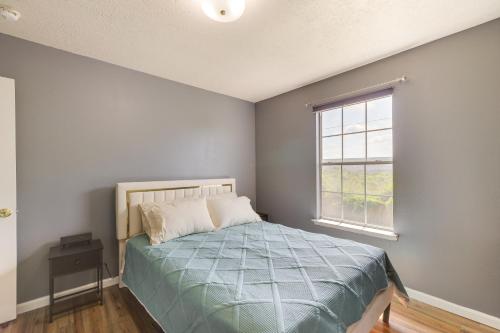 a bedroom with a bed and a window at Houston Vacation Rental 14 Mi to Downtown in Houston