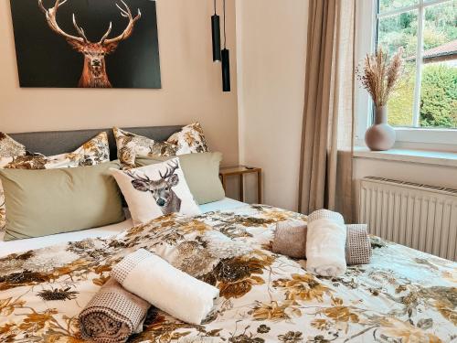 a bedroom with a bed with a deer on it at Panorama-Refugium in Bad Koetzting
