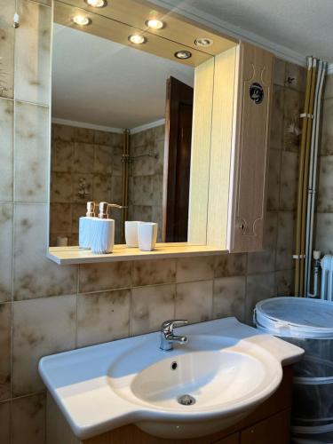 a bathroom with a sink and a mirror at Lazaros family home in Nea Michaniona