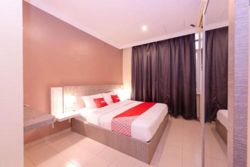 Ένα ή περισσότερα κρεβάτια σε δωμάτιο στο Spring Inn Hotel