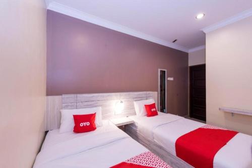 Ένα ή περισσότερα κρεβάτια σε δωμάτιο στο Spring Inn Hotel