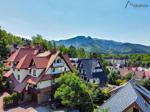 an aerial view of a village with houses and mountains at Willa Michałówka in Zakopane