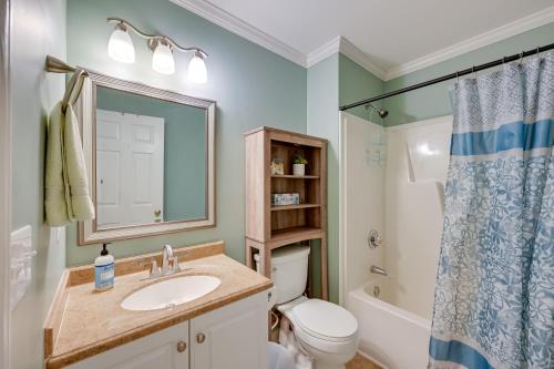 a bathroom with a sink and a toilet and a shower at 1-Acre Family Home with Pool about 11 Mi to Greensboro in Monticello