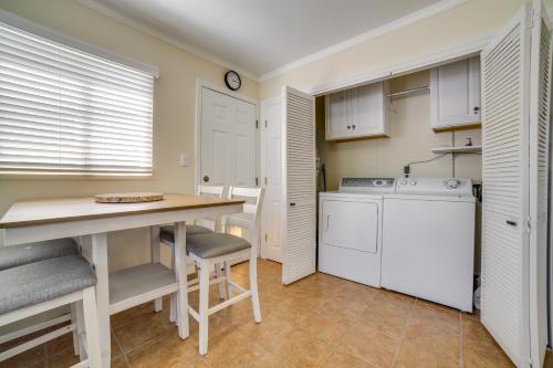 a kitchen with a washer and dryer and a table at 17 Mi to Lake Tahoe Carson City Home with Yard in Carson City