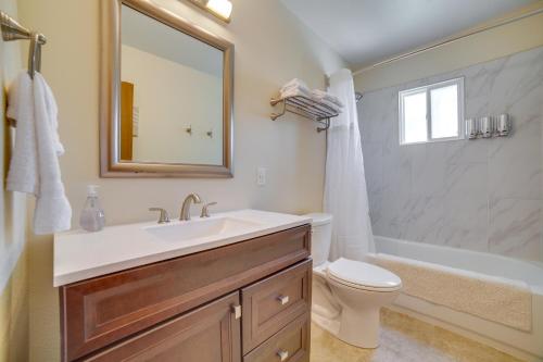 a bathroom with a sink and a toilet and a tub at Carson City Vacation Rental about 19 Mi to Lake Tahoe! in Carson City