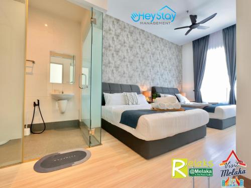 Postel nebo postele na pokoji v ubytování TheWave Residence By Heystay Management