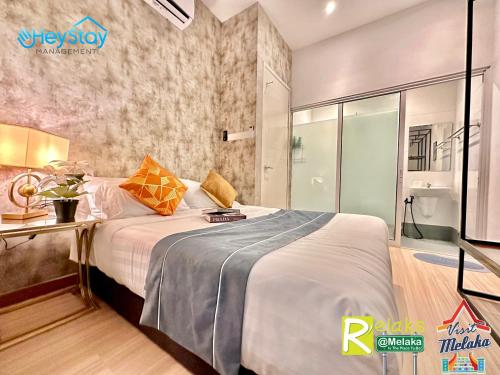 Postel nebo postele na pokoji v ubytování TheWave Residence By Heystay Management