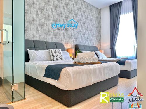 Postel nebo postele na pokoji v ubytování TheWave Residence By Heystay Management