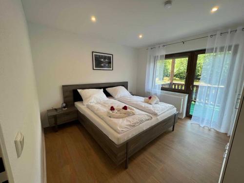 Postel nebo postele na pokoji v ubytování Ferienhaus am blauen Wasser