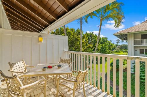 a patio with a table and chairs on a porch at Beautiful Poipu 1Br Condo with AC KP237 in Koloa
