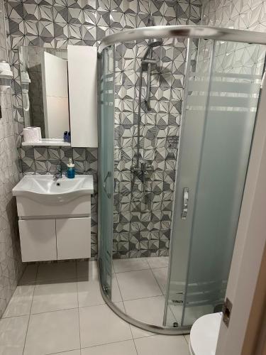 a bathroom with a shower and a sink at Aura Boutique Hotel in Side