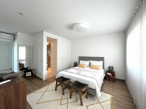 Llit o llits en una habitació de Mar-à-Vista Apartment Nazaré
