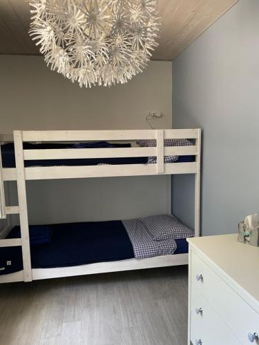 a bedroom with a bunk bed with a chandelier at Tenuta di Quaranta in Amaroni