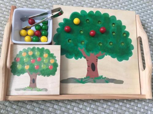 a wooden box with a picture of a tree and fruit at Family Break in Newmarket in Newmarket