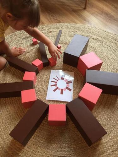 a young child playing with a wooden puzzle game at Family Break in Newmarket in Newmarket