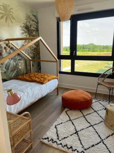 Ένα ή περισσότερα κρεβάτια σε δωμάτιο στο A 10 mn de Disney Land Paris Appartement neuf