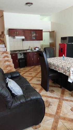 a living room with a couch and a table at ApartADE in Saltillo